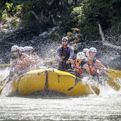splashing on the family rafting adventure on kicking horse river