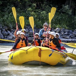 family rafting the gentle upper canyon of the kicking horse river
