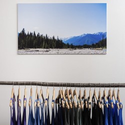 tank tops hanging in glacier raft company store