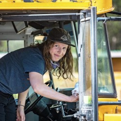 driver cleaner her bus after a day of kicking horse river rafting