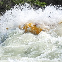 raft hitting huge rapid on the kicking horse river