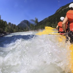 rapid splashing into raft on kicking horse river