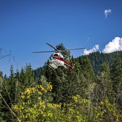 helicopter taking guests to heli raft the kicking horse river lower canyon