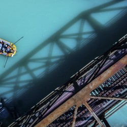drone photo of boat going kicking horse river rafting