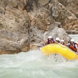 raft going down kicking horse river with smiling rafters