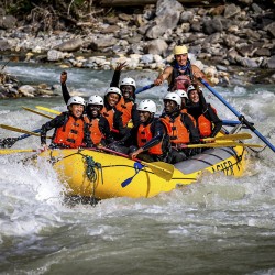 friends smiling while on kicking horse white water rafting trip