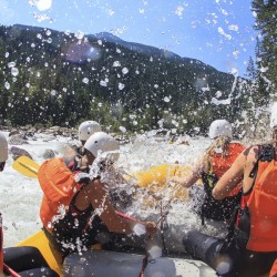 raft going through a rapid on the kicking horse river