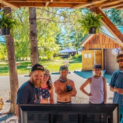 Guests viewing their photos after rafting the full day trip on the Kicking Horse River