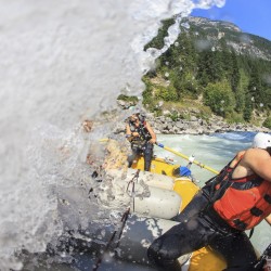 wave crashing over raft on kicking horse river