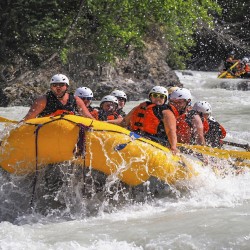 guests having fun rafting kicking horse river