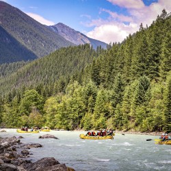 3 rafts going down kicking horse river