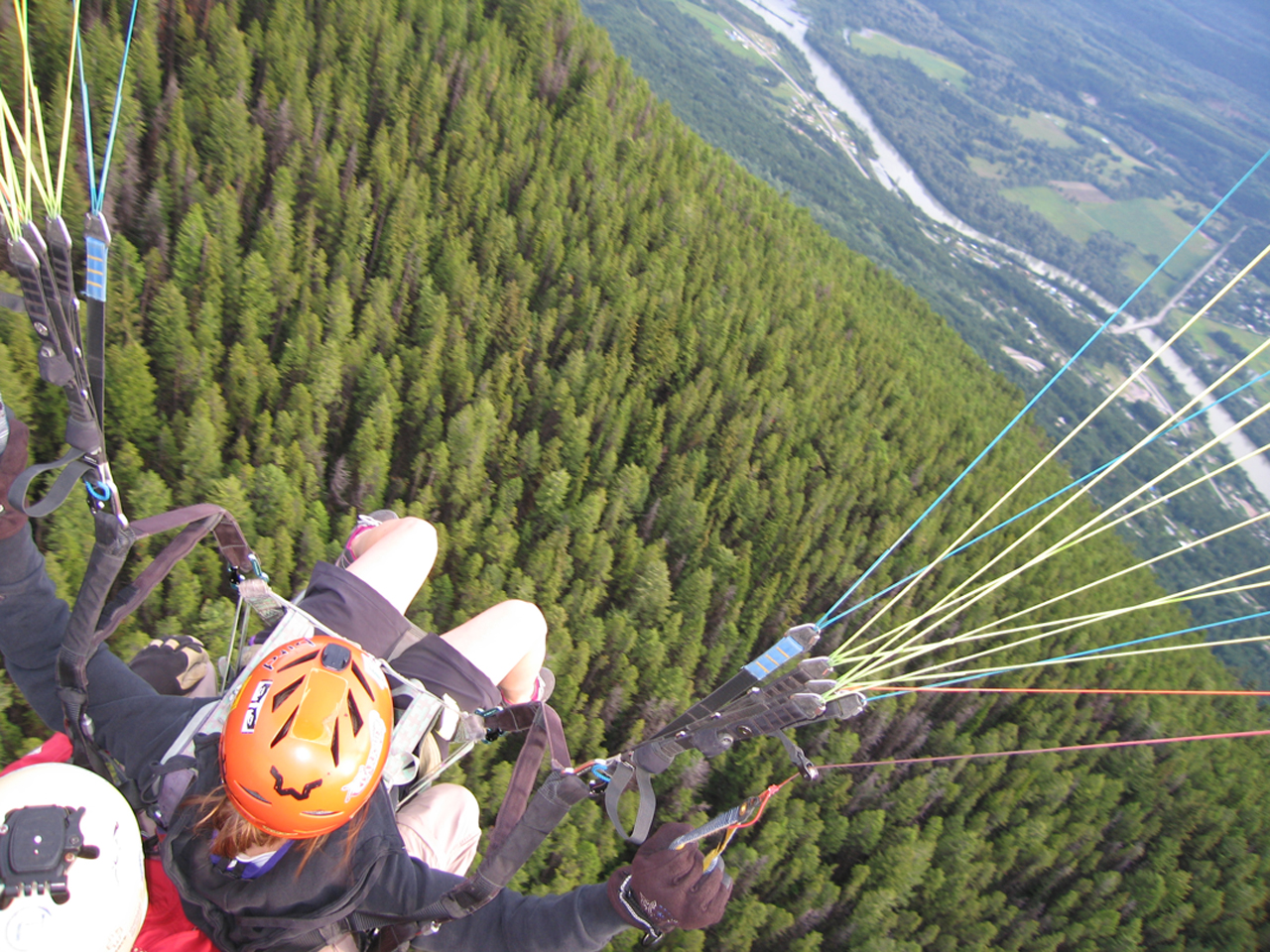 Girl paragliding from Mount 7 in Golden