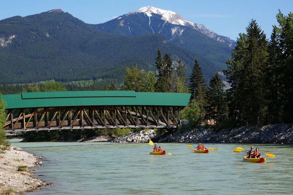a group with inflatable kayak rentals paddling in Golden BC