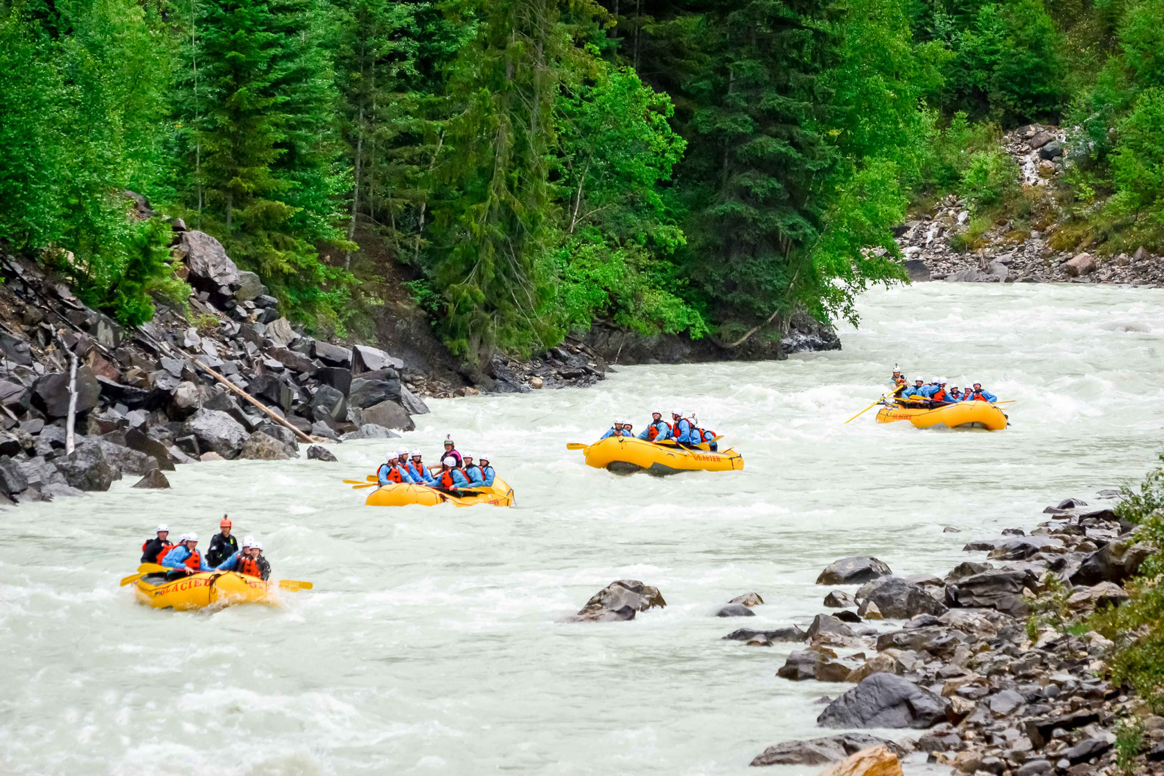 4 boats rafting the Kicking Horse River in Golden BC