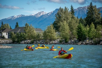 Inflatable kayaks floating through Golden British Columbia