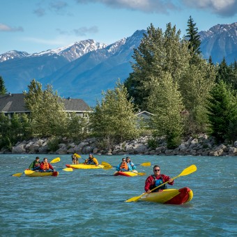 Inflatable kayaks floating through Golden British Columbia