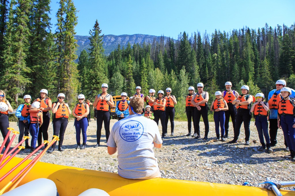 Glacier Raft Company guide giving a safety talk before the rafting trip begins