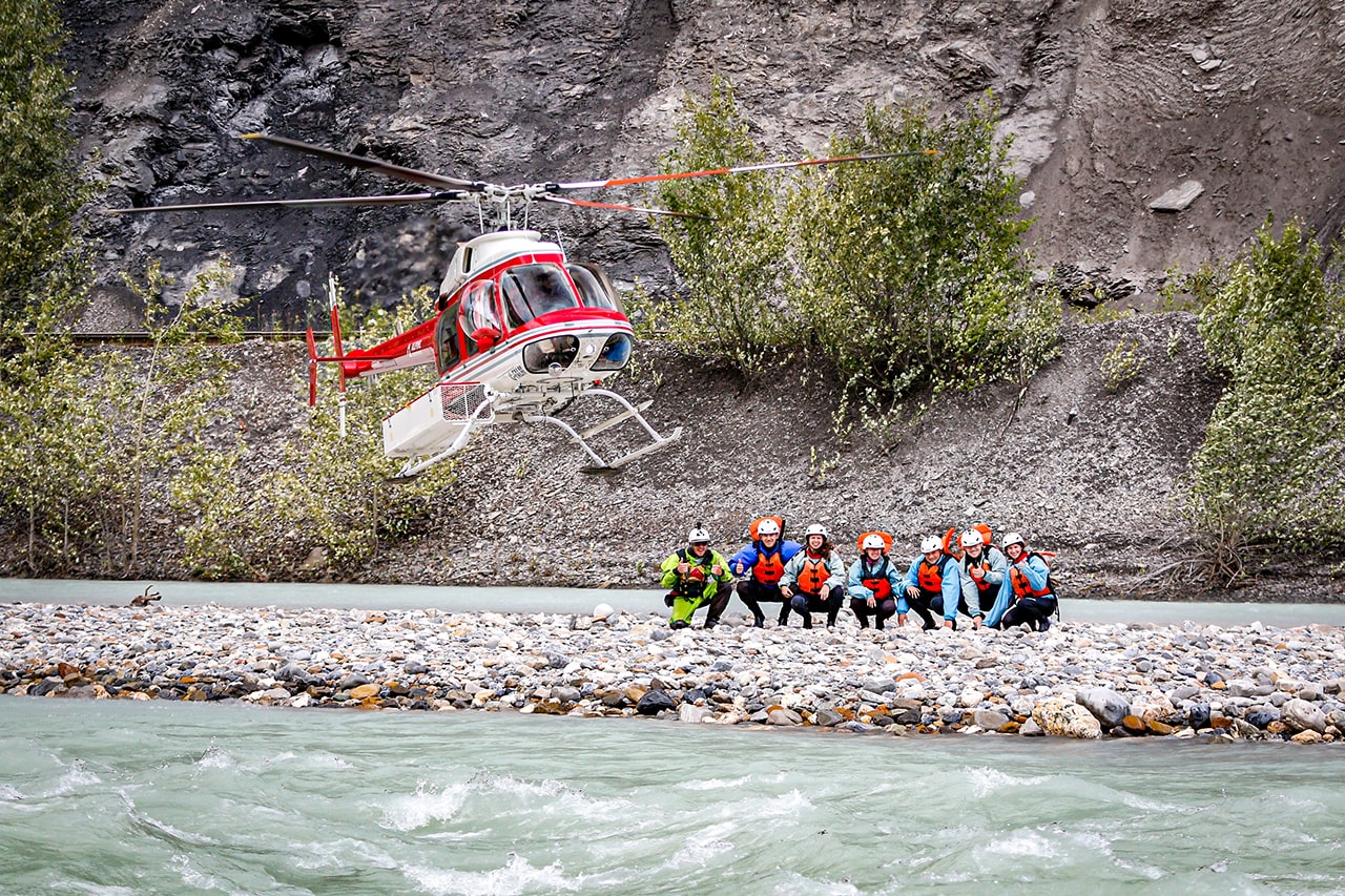 Helicopter flying rafters to Kicking Horse River Lower Canyon