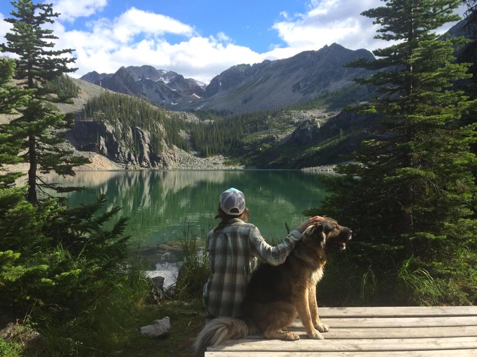 girl and dog on quartz lake hike in quartz creek golden bc