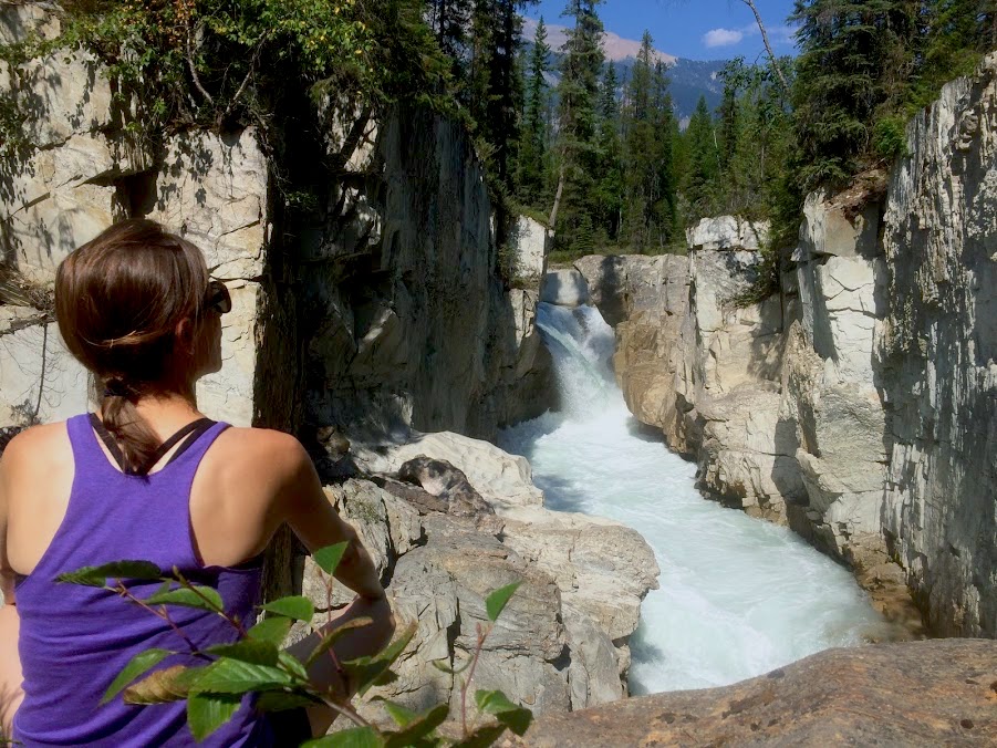 A girl looking down at Thompson Falls