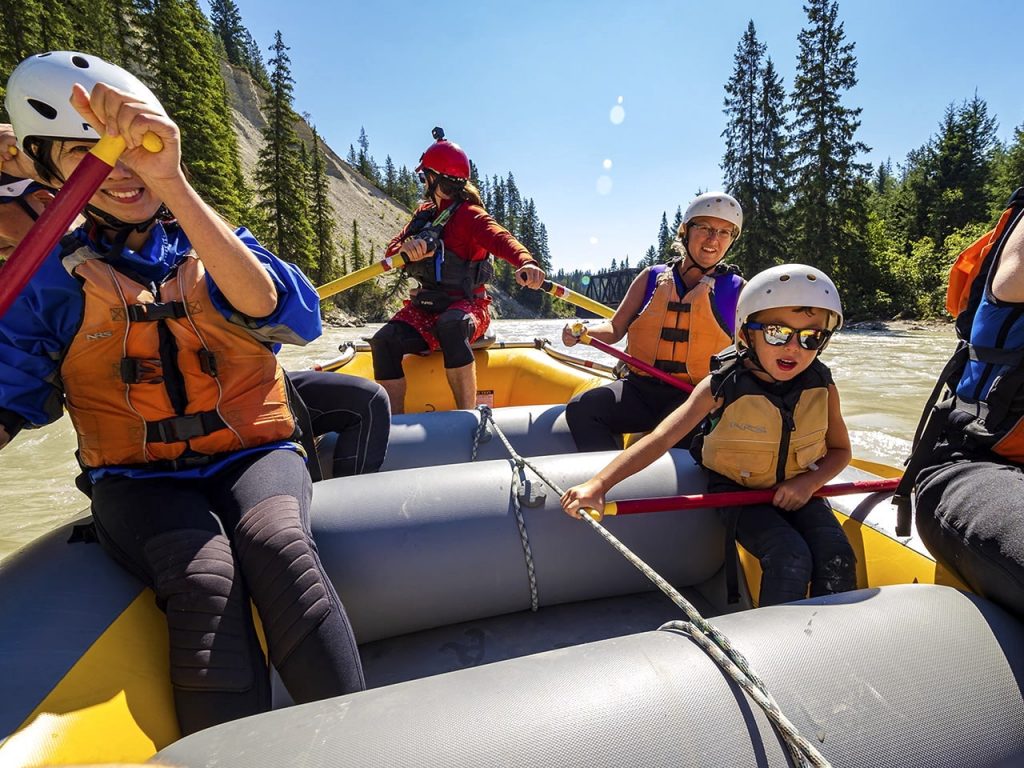 A family rafting the calm section of the Kicking Horse River
