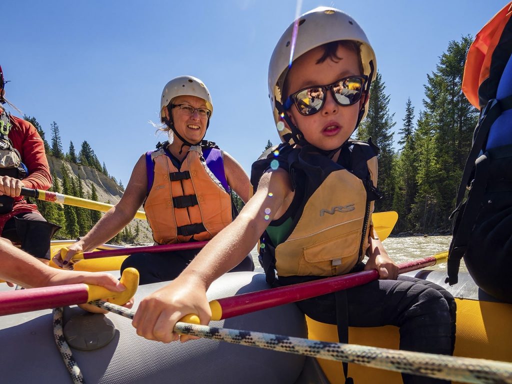 Little boy and his mom rafting the Kicking Horse River. Being able to expend energy is a benefit to spending time outside with your kids