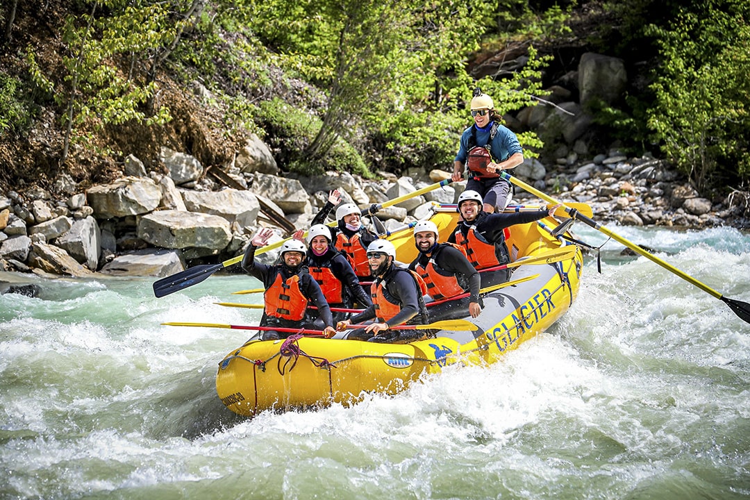 friends rafting and smiling on kicking horse river